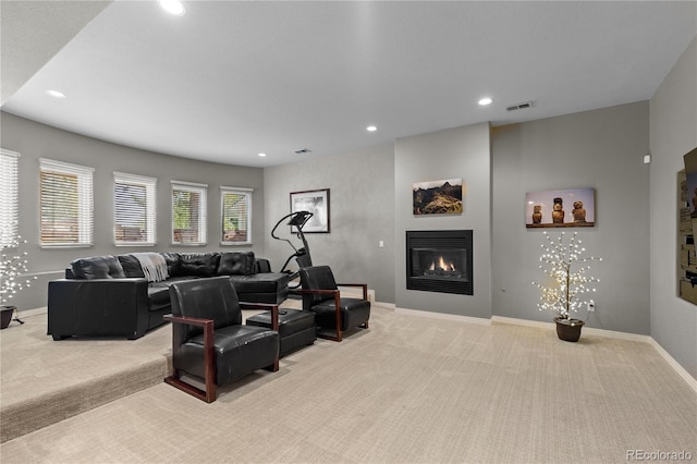 69 N Ranch Rd, Littleton, CO 80127 - living area with light colored carpet, a glass covered fireplace, baseboards, and recessed lighting