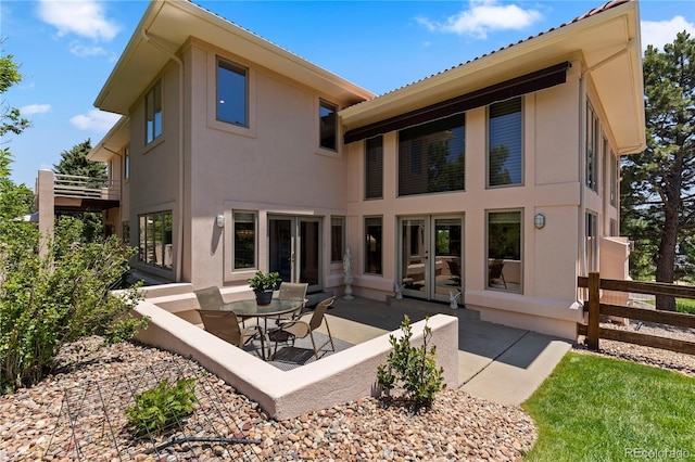 69 N Ranch Rd, Littleton, CO 80127 - rear view of property with french doors, stucco siding, and a patio area
