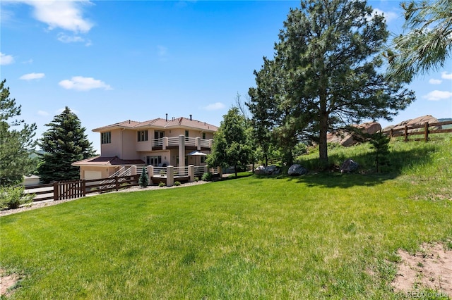 69 N Ranch Rd, Littleton, CO 80127 - view of yard with a garage and a balcony