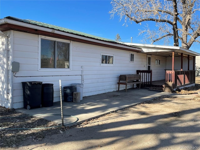 back of property with a patio