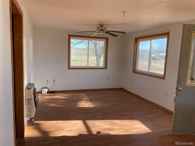 interior space with ceiling fan and hardwood / wood-style floors