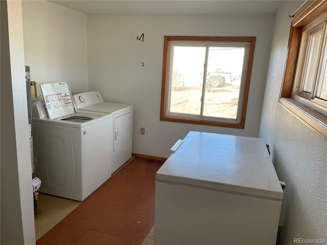 washroom featuring washing machine and dryer