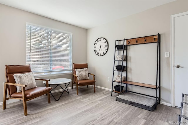 sitting room with light hardwood / wood-style flooring