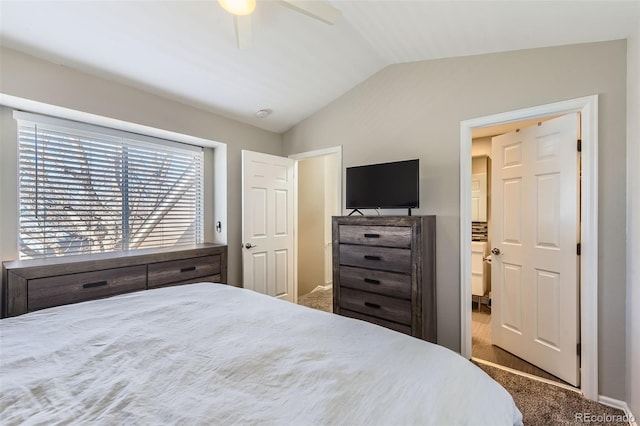 bedroom featuring ceiling fan, carpet flooring, and vaulted ceiling