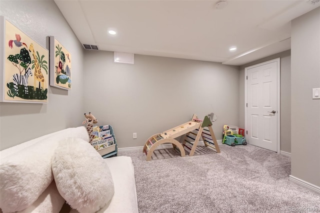 recreation room with carpet flooring