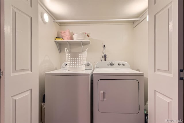 laundry area with washing machine and clothes dryer