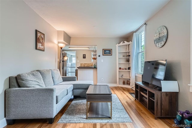 3655 Zenobia St, Denver, CO 80212 - living room with plenty of natural light, wood finished floors, and baseboards