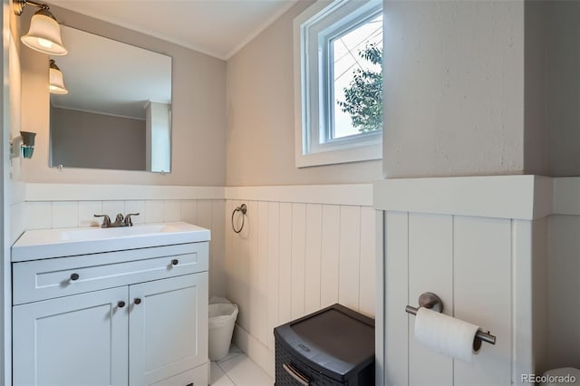 3655 Zenobia St, Denver, CO 80212 - bathroom featuring vanity, wainscoting, and toilet