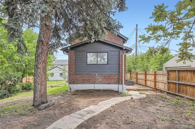3655 Zenobia St, Denver, CO 80212 - view of side of property featuring brick siding