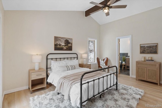 bedroom with vaulted ceiling with beams, baseboards, and wood finished floors