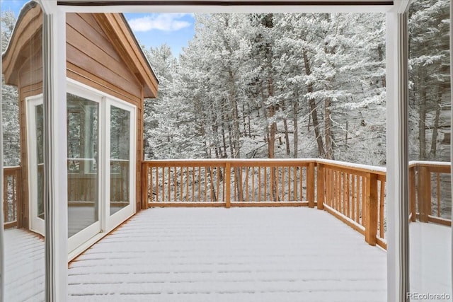 view of snow covered deck