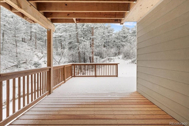 view of snow covered deck