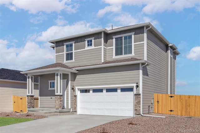 17943 E 94th Pl, Commerce City, CO 80022 - view of front facade featuring an attached garage, stone siding, concrete driveway, and board and batten siding
