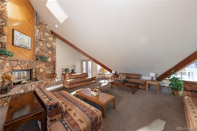 living area featuring a skylight, carpet flooring, a fireplace, and high vaulted ceiling