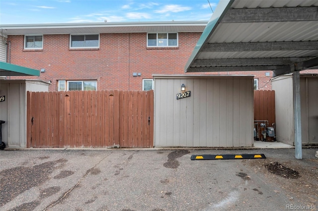 view of gate with fence