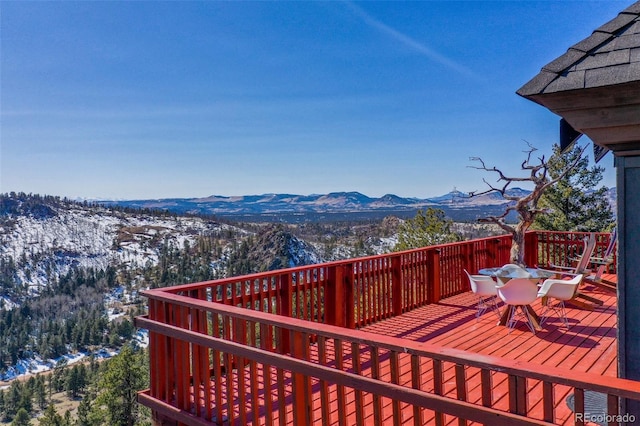 wooden deck featuring a mountain view