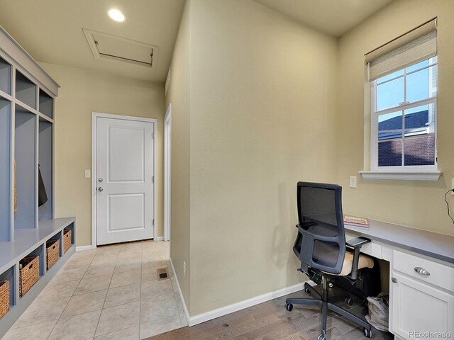 office space featuring light tile patterned floors and baseboards