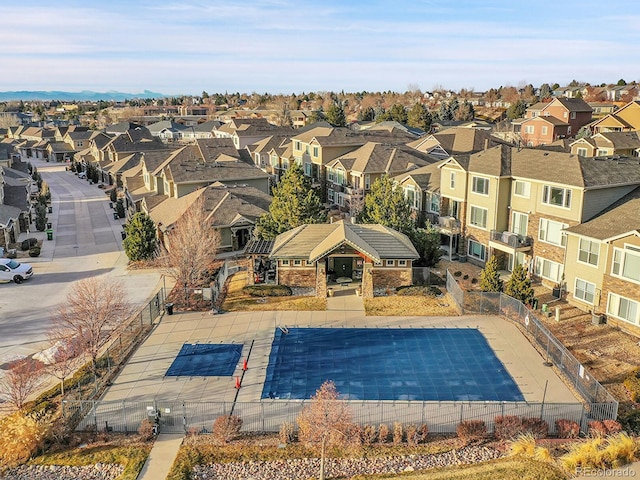 view of pool with fence and a residential view