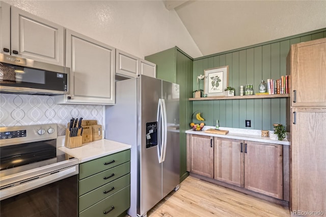 kitchen with stainless steel appliances, light countertops, backsplash, open shelves, and light wood finished floors