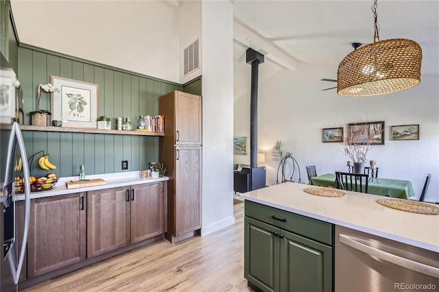 kitchen featuring visible vents, dishwasher, light wood-style flooring, vaulted ceiling with beams, and open shelves