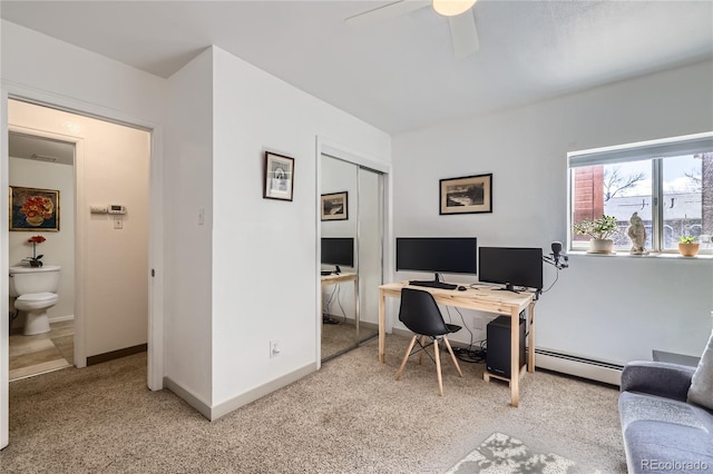 home office featuring baseboards, a baseboard heating unit, a ceiling fan, and light colored carpet