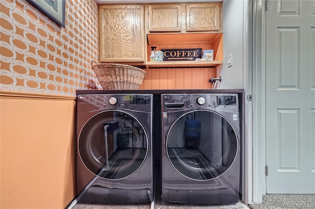 laundry area with cabinet space and independent washer and dryer