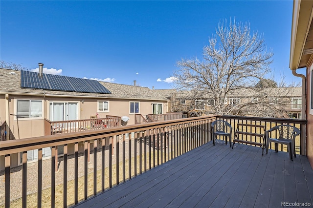 wooden terrace with a residential view