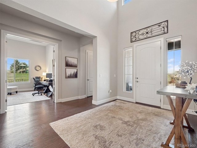 6970 E Lake Dr, Centennial, CO 80111 - foyer entrance with baseboards, dark wood finished floors, and a high ceiling