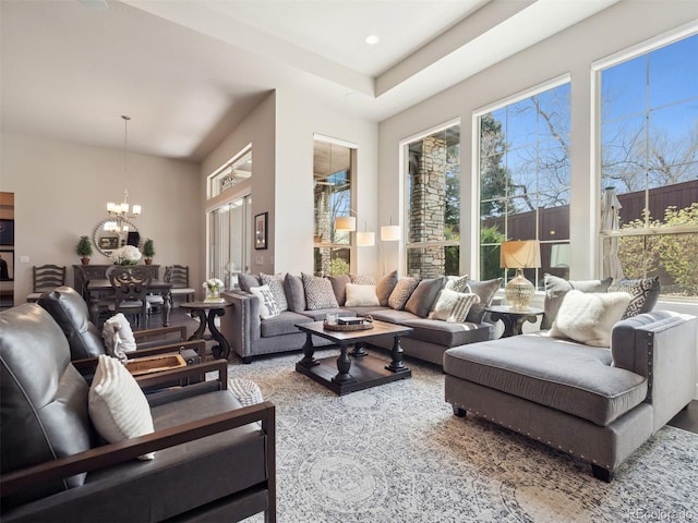 6970 E Lake Dr, Centennial, CO 80111 - living room featuring a chandelier and a healthy amount of sunlight