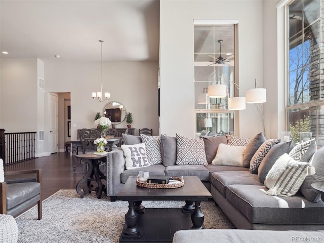 6970 E Lake Dr, Centennial, CO 80111 - living room with visible vents, wood finished floors, baseboards, ceiling fan with notable chandelier, and recessed lighting