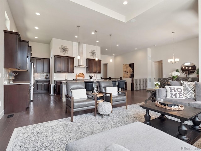 6970 E Lake Dr, Centennial, CO 80111 - living area featuring recessed lighting, dark wood-style flooring, and a notable chandelier