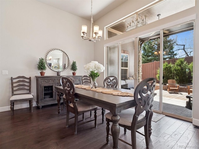 6970 E Lake Dr, Centennial, CO 80111 - dining room with baseboards, hardwood / wood-style floors, and a notable chandelier