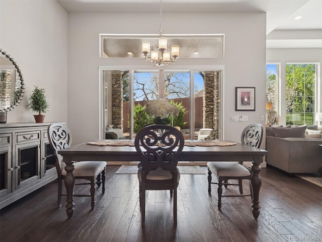 6970 E Lake Dr, Centennial, CO 80111 - dining space featuring dark wood-style flooring, a chandelier, and a wealth of natural light