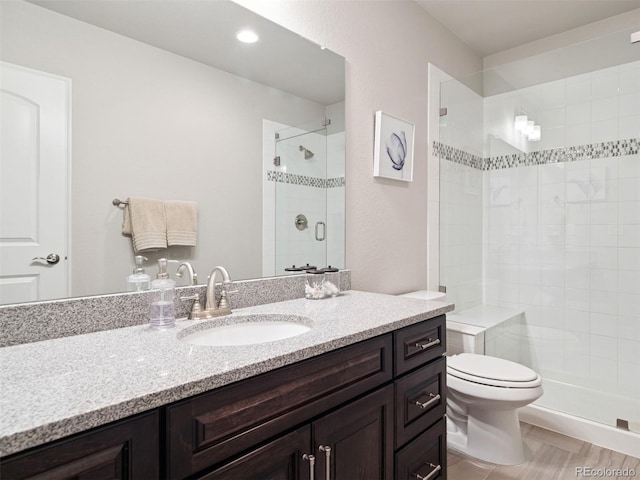 6970 E Lake Dr, Centennial, CO 80111 - full bath featuring toilet, a shower stall, and vanity