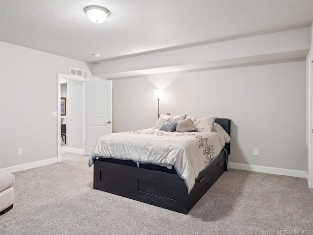 6970 E Lake Dr, Centennial, CO 80111 - bedroom featuring visible vents, a textured ceiling, carpet, and baseboards