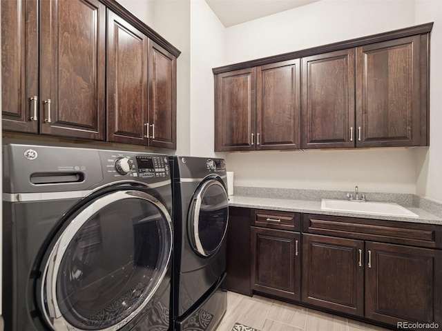 6970 E Lake Dr, Centennial, CO 80111 - laundry room featuring cabinet space, washing machine and dryer, and a sink