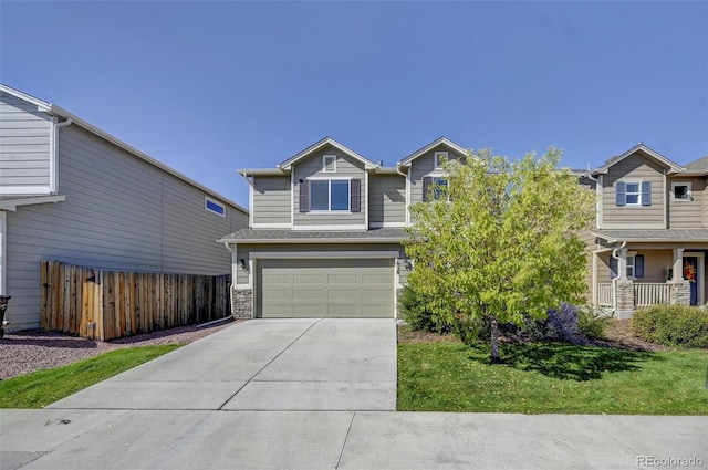 view of front of property featuring a garage and a front yard