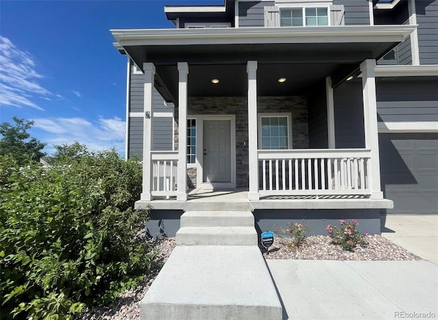 entrance to property featuring a porch