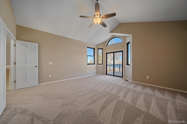 carpeted empty room featuring lofted ceiling and ceiling fan