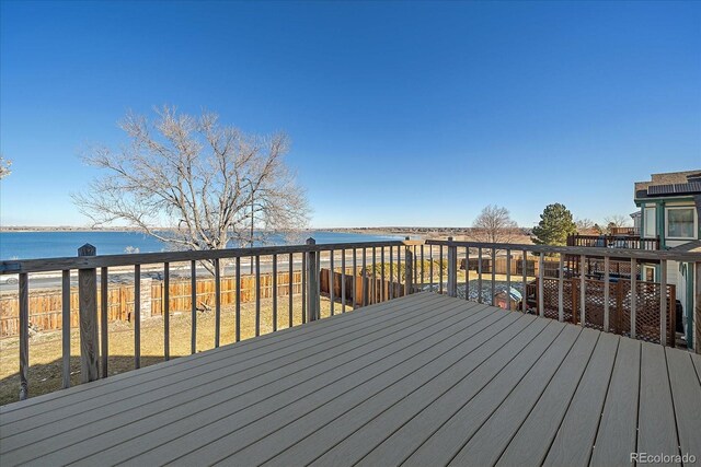 wooden deck with a water view