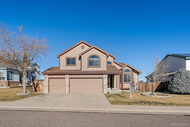 view of front of house featuring a front yard and a garage