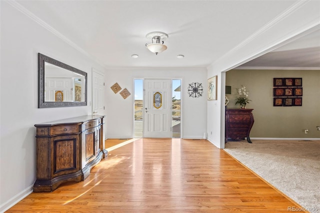 entrance foyer with crown molding and light wood-type flooring