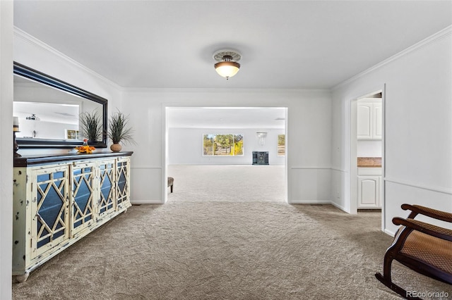 corridor featuring crown molding and carpet flooring