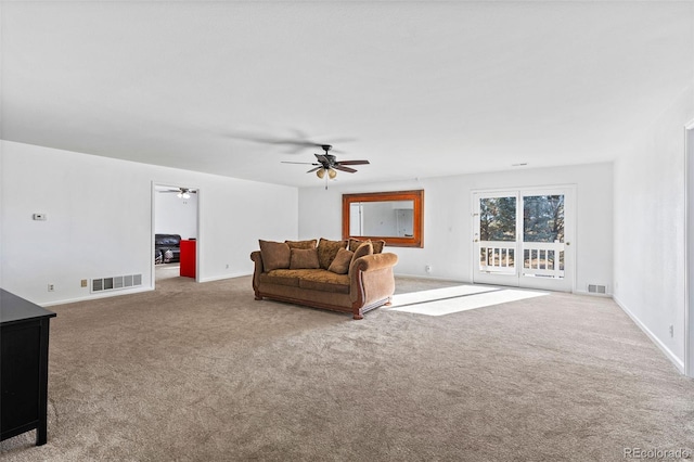 living room featuring carpet flooring and ceiling fan