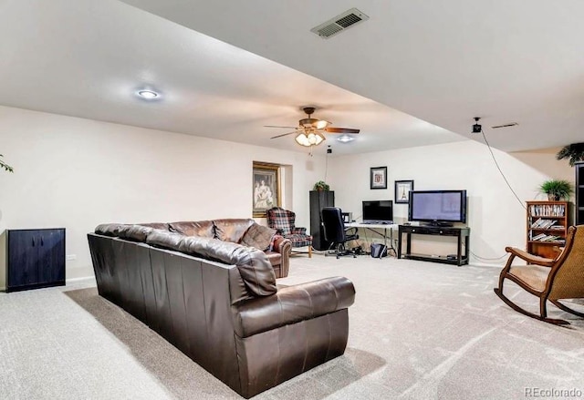 carpeted living room with ceiling fan