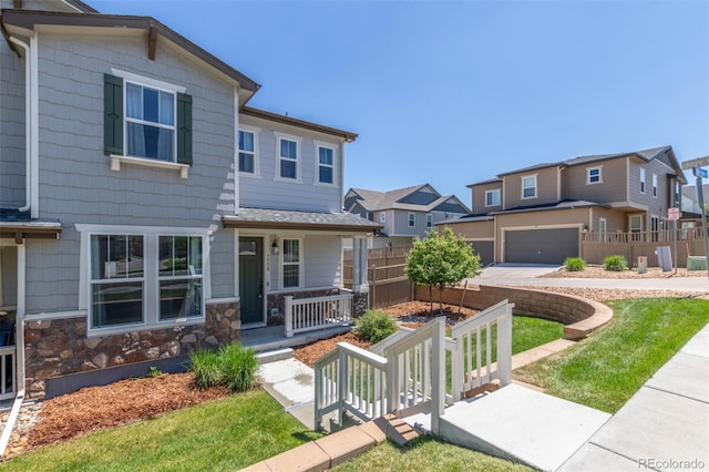 3338 Ireland Moss St, Castle Rock, CO 80109 - view of front of home with a residential view, a porch, and stone siding