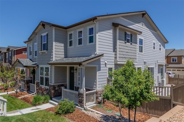3338 Ireland Moss St, Castle Rock, CO 80109 - view of front of house featuring a porch and stone siding