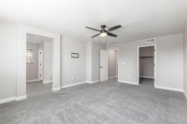 3338 Ireland Moss St, Castle Rock, CO 80109 - unfurnished bedroom with carpet, a walk in closet, and a ceiling fan