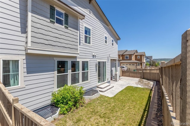 3338 Ireland Moss St, Castle Rock, CO 80109 - back of house with a patio, a fenced backyard, and a residential view