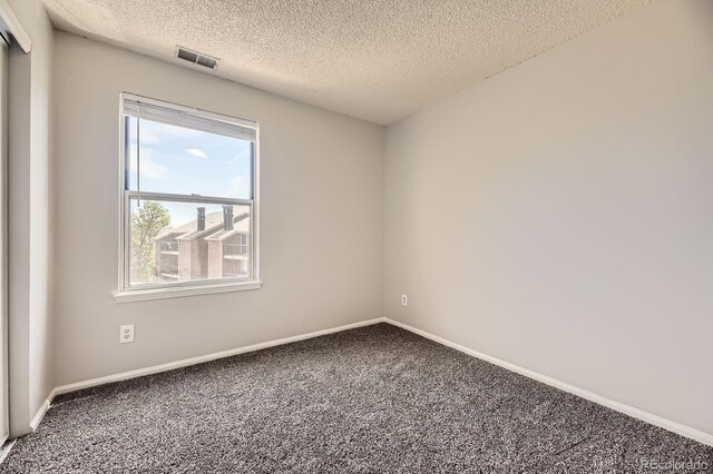 4899 S Dudley St Unit 20G, Littleton, CO 80123 - empty room with carpet, a textured ceiling, and baseboards